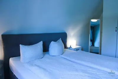 Ein Bett oder Betten in einem Zimmer der Unterkunft Ferienwohnung Schmidt