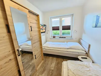 Ein Bett oder Betten in einem Zimmer der Unterkunft Appartementhaus Kogge Wohnung 3