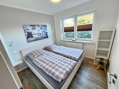 Ein Bett oder Betten in einem Zimmer der Unterkunft Appartementhaus Kogge Wohnung 3