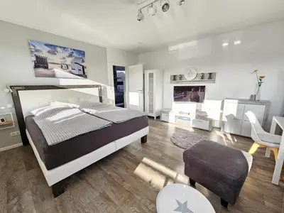 Ein Bett oder Betten in einem Zimmer der Unterkunft Appartementhaus Kogge Wohnung 4