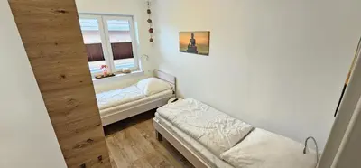 Ein Bett oder Betten in einem Zimmer der Unterkunft Appartementhaus Kogge Wohnung 6