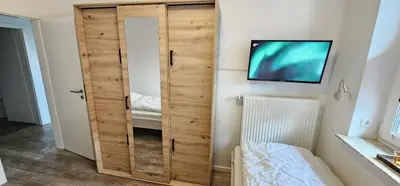 Ein Bett oder Betten in einem Zimmer der Unterkunft Appartementhaus Kogge Wohnung 6