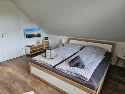 Ein Bett oder Betten in einem Zimmer der Unterkunft Appartementhaus Kogge Wohnung 7