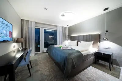 Ein Bett oder Betten in einem Zimmer der Unterkunft Strandhotel Duhnen