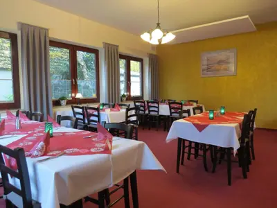 Ein Restaurant oder anderes Speiselokal in der Unterkunft Nordseehotel Eymers
