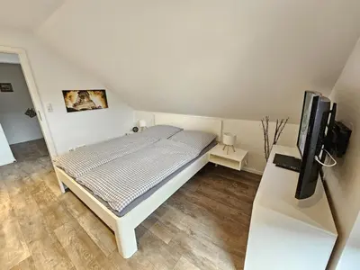 Ein Bett oder Betten in einem Zimmer der Unterkunft Appartementhaus Kogge Wohnung 8