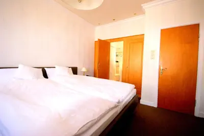 Ein Bett oder Betten in einem Zimmer der Unterkunft Hotel Beckröge