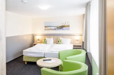 Ein Bett oder Betten in einem Zimmer der Unterkunft Gästehaus Alexandra