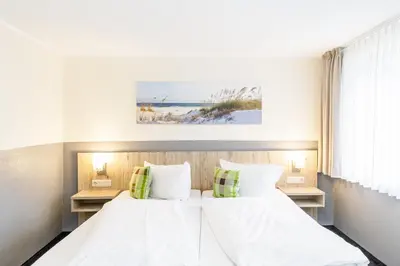 Ein Bett oder Betten in einem Zimmer der Unterkunft Gästehaus Alexandra