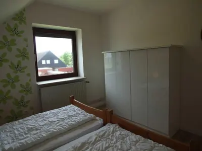 Ein Bett oder Betten in einem Zimmer der Unterkunft Doppelhaushälfte Thormählen/Wulf
