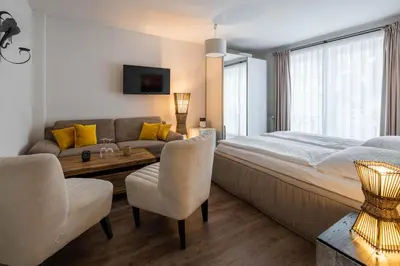 Ein Bett oder Betten in einem Zimmer der Unterkunft Hotel Luina Beach