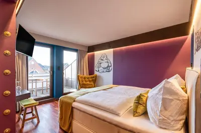Ein Bett oder Betten in einem Zimmer der Unterkunft Hotel Luina Beach