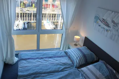 Ein Bett oder Betten in einem Zimmer der Unterkunft Ferienhaus Hafenzeit