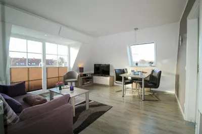Ein Sitzbereich in der Unterkunft Ferienwohnung in der Residenz Vogelsand