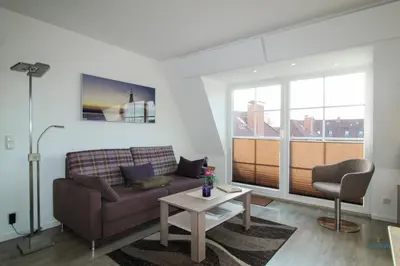 Ein Sitzbereich in der Unterkunft Ferienwohnung in der Residenz Vogelsand