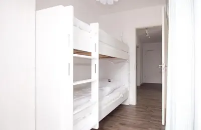 Ein Bett oder Betten in einem Zimmer der Unterkunft Wohnen am Yachthafen W25