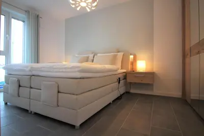 Ein Bett oder Betten in einem Zimmer der Unterkunft Wohnen am Yachthafen W25