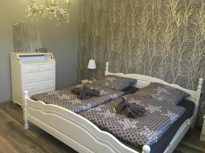 Ein Bett oder Betten in einem Zimmer der Unterkunft Feriendomizil im Musikerviertel in Otterndorf