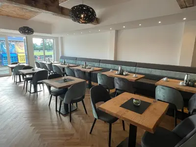 Ein Restaurant oder anderes Speiselokal in der Unterkunft Sporthotel Dorum