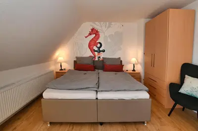 Ein Bett oder Betten in einem Zimmer der Unterkunft Ferienwohnung NORDIA Allee und See