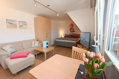 Ein Sitzbereich in der Unterkunft Ferienwohnung NORDIA Allee und See