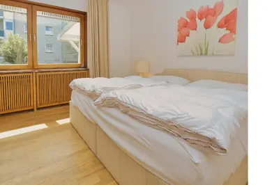 Ein Bett oder Betten in einem Zimmer der Unterkunft Stranddomicil Steiner - Gästehäuser
