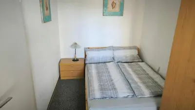 Ein Bett oder Betten in einem Zimmer der Unterkunft Frische Brise 01.09