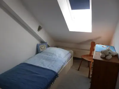 Ein Bett oder Betten in einem Zimmer der Unterkunft Ferienwohnung Meisennest