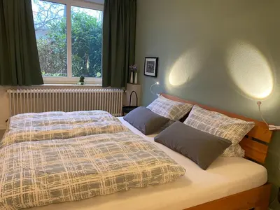 Ein Bett oder Betten in einem Zimmer der Unterkunft Altes Pastorenhus - Land und Meer