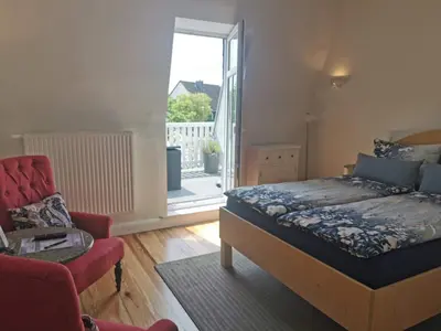 Ein Bett oder Betten in einem Zimmer der Unterkunft Haus Deichvoigt