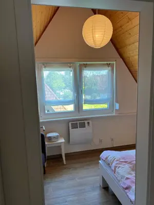 Ein Bett oder Betten in einem Zimmer der Unterkunft Ferienhaus Vogel - Dorum Neufeld - Nordsee