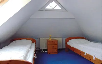 Ein Bett oder Betten in einem Zimmer der Unterkunft Beautiful Home In Wurster Nordseeküste