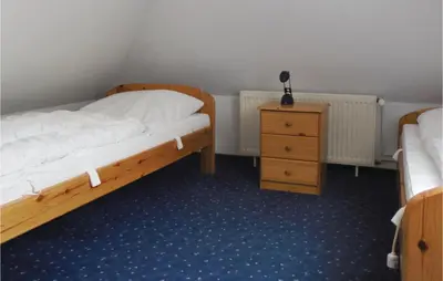 Ein Bett oder Betten in einem Zimmer der Unterkunft Beautiful Home In Wurster Nordseeküste