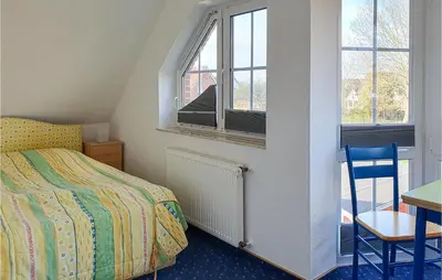 Ein Bett oder Betten in einem Zimmer der Unterkunft Beautiful Home In Wurster Nordseeküste