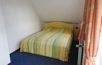 Ein Bett oder Betten in einem Zimmer der Unterkunft Beautiful Home In Wurster Nordseeküste