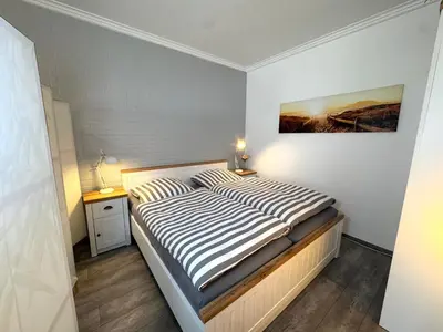 Ein Bett oder Betten in einem Zimmer der Unterkunft Landhaus Nordsee-Peerhuus