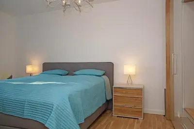 Ein Bett oder Betten in einem Zimmer der Unterkunft Haus Yachthafen 4