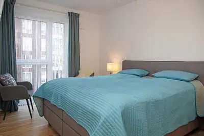 Ein Bett oder Betten in einem Zimmer der Unterkunft Haus Yachthafen 4