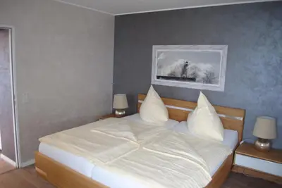 Ein Bett oder Betten in einem Zimmer der Unterkunft Terrassenhaus Penthouse-Wohnung 93