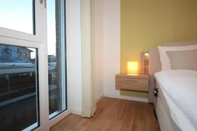 Ein Bett oder Betten in einem Zimmer der Unterkunft Wohnen am Yachthafen W45