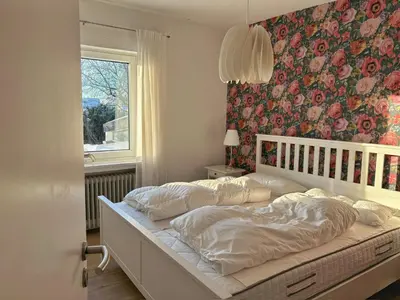 Ein Bett oder Betten in einem Zimmer der Unterkunft Ferienhaus Lemafri Duhnen