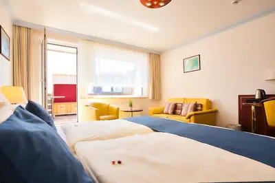 Ein Bett oder Betten in einem Zimmer der Unterkunft Hotel Meeresruh Garni