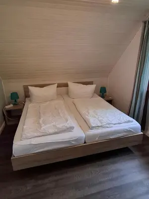 Ein Bett oder Betten in einem Zimmer der Unterkunft Ferienhaus Sander