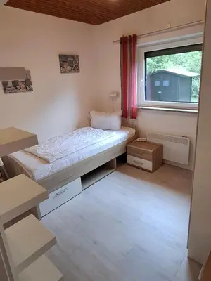 Ein Bett oder Betten in einem Zimmer der Unterkunft Ferienhaus Sander