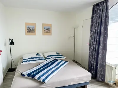 Ein Bett oder Betten in einem Zimmer der Unterkunft Urlaub mit Blick auf den Duhner Strand