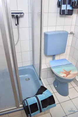 Ein Badezimmer in der Unterkunft Urlaub direkt am Duhner Strand