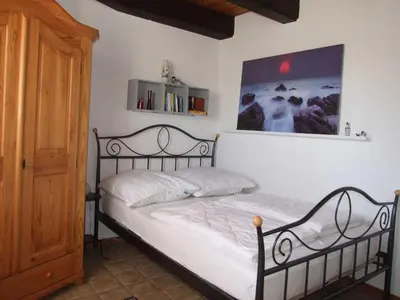 Ein Bett oder Betten in einem Zimmer der Unterkunft Ferienwohnung Baade -KEINE MONTEURE-