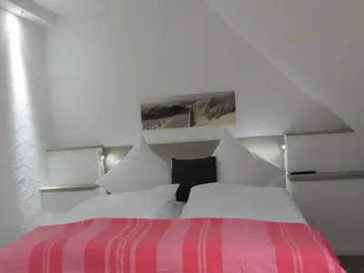 Ein Bett oder Betten in einem Zimmer der Unterkunft dat geele hus 5
