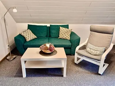 Ein Sitzbereich in der Unterkunft Ferienwohnung Butendiek