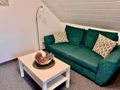 Ein Sitzbereich in der Unterkunft Ferienwohnung Butendiek